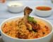 Authentic chicken biryani in Spain served in a white bowl with basmati rice