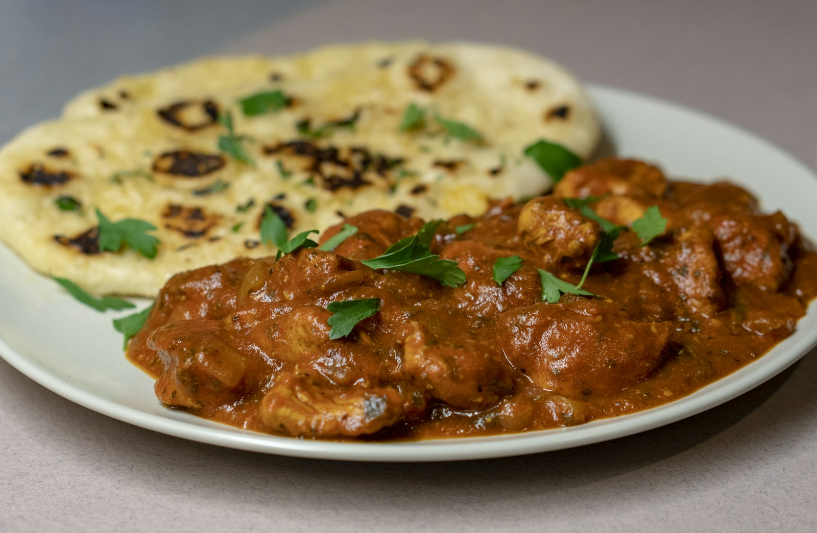 Butter Chicken in Spain - tender chicken in makhani sauce with roti