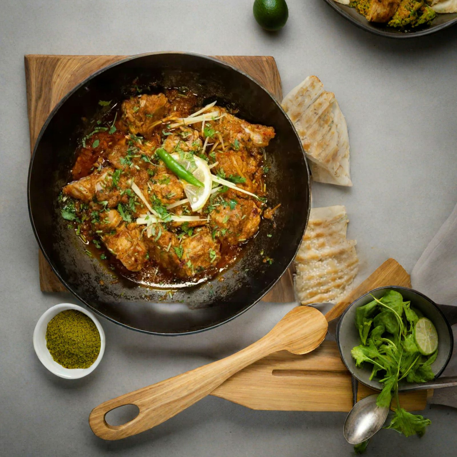 Cooking chicken masala in a pan for authentic chicken biryani