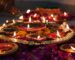 Diwali Sweets in Spain - lit clay diyas and flower petals for the festival of lights